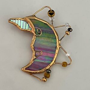 Very cool pink/green/blue/gold color pin.  Beads hanging from moon shaped pin.